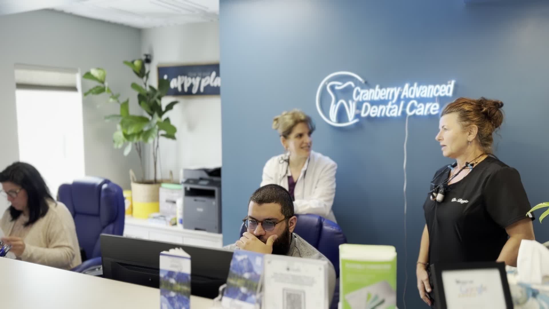Front desk and team area at Cranberry Advanced Dental Care